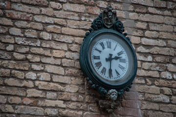 Fototapeta premium Old and ornate venetian clock on a wall.