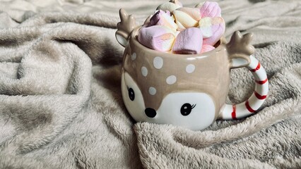 cup of coffee with marshmallows and christmas decorations Christmas deer