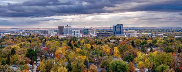 Panoramic of Boise Idaho and fall colors with dramatic sky