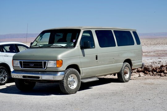 Vintage Grey American Ford Minibus by the salt lake. Los Flamencos National Reserve, Chile, October 14, 2023. 