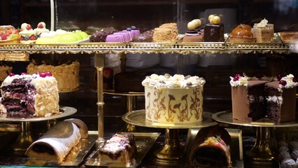 Beautiful fancy cakes in the restaurant on the shop window