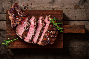 Grilled Beef Steak Sliced ​​on Wooden Cutting Board