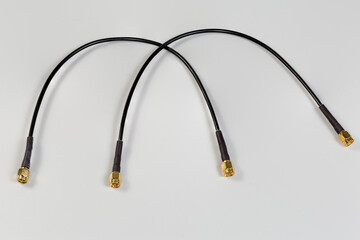 Two high-frequency cable adapters with yellow coaxial threaded connectors