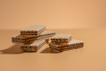A stack of wafers with a brownish color. The wafers are stacked on top of each other
