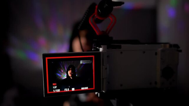 A video blogger in a latex glove says something about a gel lubricant