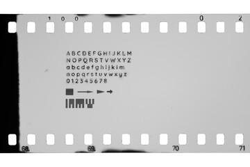 35mm film with perforations and different letters, digits, symbols marks isolated. Transparent PNG image.