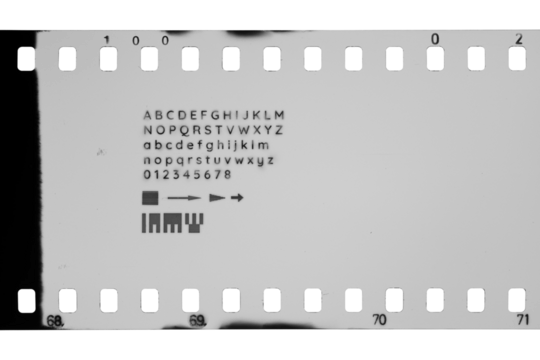 35mm film with perforations and different letters, digits, symbols marks isolated. Transparent PNG image.