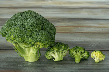 brocolis isolated on wooden background. horizontal shot.