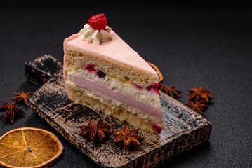 Piece of sweet cake with pink cream with raspberry flavor, with shortbread, cheesecake