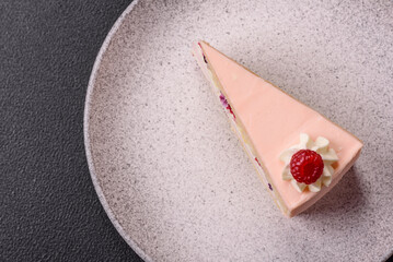 Piece of sweet cake with pink cream with raspberry flavor, with shortbread, cheesecake
