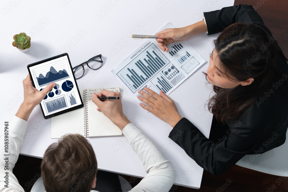 Fototapete top view analyst team uses bi fintech display tablet to analyze financial data. business people anal