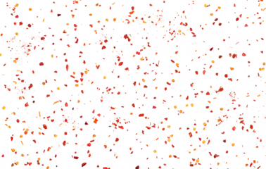 Spicy chili red pepper flakes flying, chopped, milled dry paprika pile isolated on white