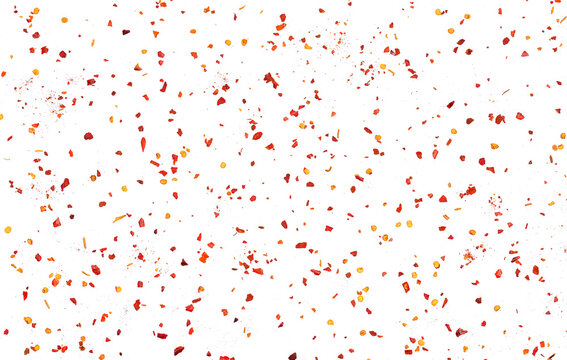 Spicy chili red pepper flakes flying, chopped, milled dry paprika pile isolated on white