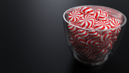Christmas Peppermint Swirls on Glass Pot on Dark Background.
