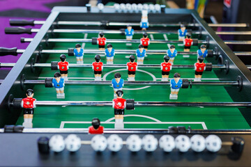 Table football in a modern game room in close-up.