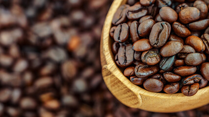 Close-up of roasted coffee beans in a wooden bowl with a blurred background. Perfect for themes of coffee culture, freshness, and artisanal brewing.