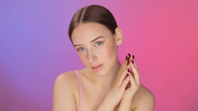 Portrait of attractive girl with healthy clean skin and beautiful make-up. Aesthetic cosmetology and makeup concept.