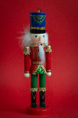Nutcracker toy on redbackground