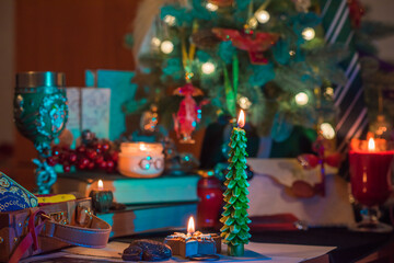 Christmas cozy magic details at table. Christmas eve prediction with candles.