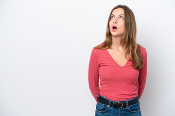 Obraz premium Young caucasian woman isolated on white background looking up and with surprised expression