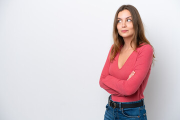 Young caucasian woman isolated on white background making doubts gesture while lifting the shoulders