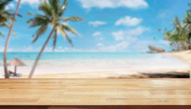 Empty wooden table front blur sea background, beach view and coconut trees, blue sky, summer relaxing feeling, wooden texture for coffee shop, drink or food, holiday travel.