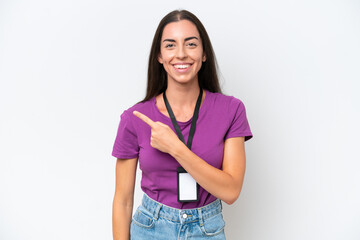 Obraz premium Young caucasian woman with ID card isolated on white background pointing to the side to present a product