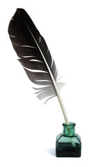Feather in inkwell. Calligraphy, old education, vintage fonts. Quill pen and bottle of ink