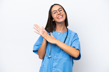 Young surgeon doctor woman isolated on white background applauding after presentation in a conference