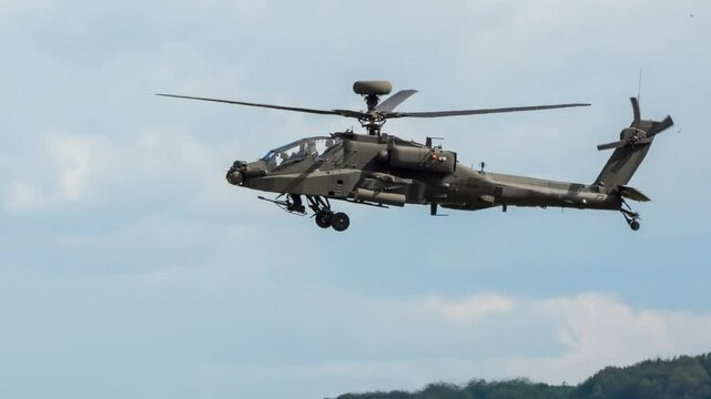 British army Boeing Apache Attack helicopter gunship AH64E AH-64E ArmyAirCorp AAC AH2 in low level flight