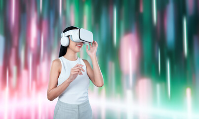 Female standing and wearing white VR headset and white sleeveless connect metaverse, future...