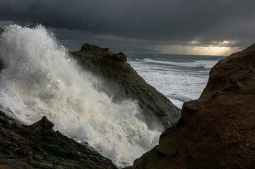 Waves crashing along Oregon Coast at Cape Kiwanda State Natural Area.