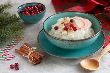 Traditional Scandinavian-style rice porridge, pudding in Christmas style with decoration, close up, top view