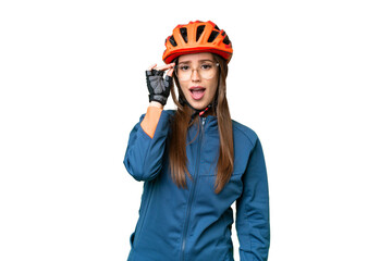 Young cyclist woman over isolated chroma key background with glasses and surprised