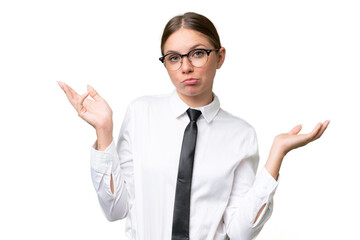 Young business caucasian woman over isolated background having doubts while raising hands