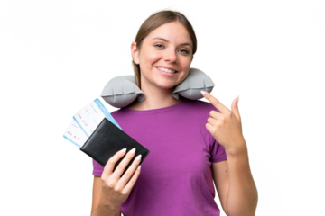 Young beautiful blonde woman with Inflatable travel Pillow over isolated background giving a thumbs up gesture