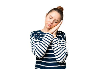 Young blonde woman over isolated chroma key background making sleep gesture in dorable expression