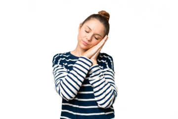 Young blonde woman over isolated chroma key background making sleep gesture in dorable expression