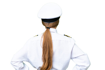 Airplane pilot woman over isolated chroma key background in back position