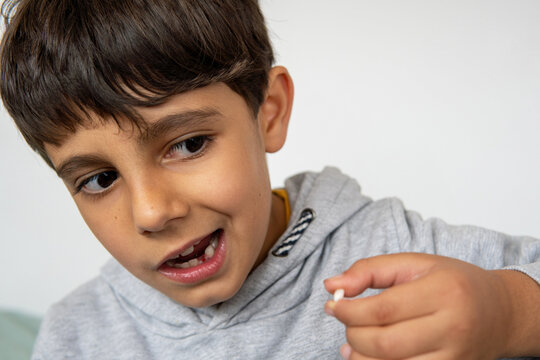 Child Celebrating Tooth Loss Awaiting Tooth Fairy Visit