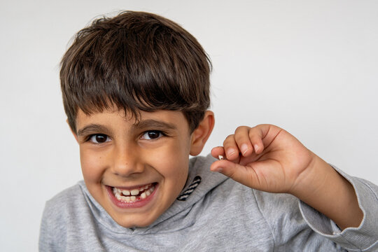 Child with a lost baby tooth, excited for the tooth fairy
