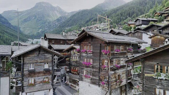 Drone View of  Swiss Alpine Village Grimentz with Blooming Geraniums. 