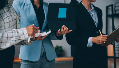 Fund managers team consultation and discuss about analysis Investment stock market at office