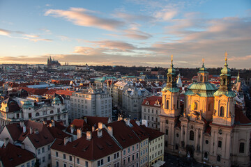 Obraz premium The view from the Old Town Hall over the roofs to Prague Castle in the evening sun