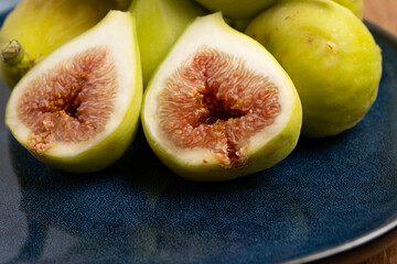 Fresh Green Figs Halved on Blue Plate
