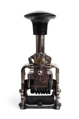 Vintage mechanical numerator isolated on white background. Close-up of an old mechanical numerator. Antique vintage counter.