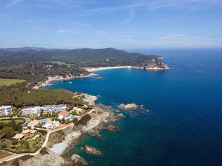 Aerial cityscape view of beach and Mediterranean Sea along Costa Brava in Palamos Catalonia