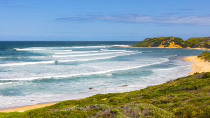 beach in the summer. Waves Rolling in from the Atlantic Ocean. Stilbaai Beach.