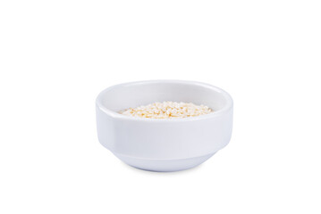 Sesame seeds in a white bowl on a white isolated background