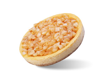 Cheesecake with caramelized cinnamon apple slices on a white isolated background